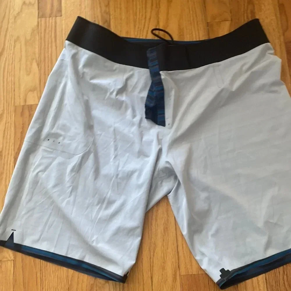 Lululemon swim trunks board shorts size 38 Blue Black Gray tie front EUC